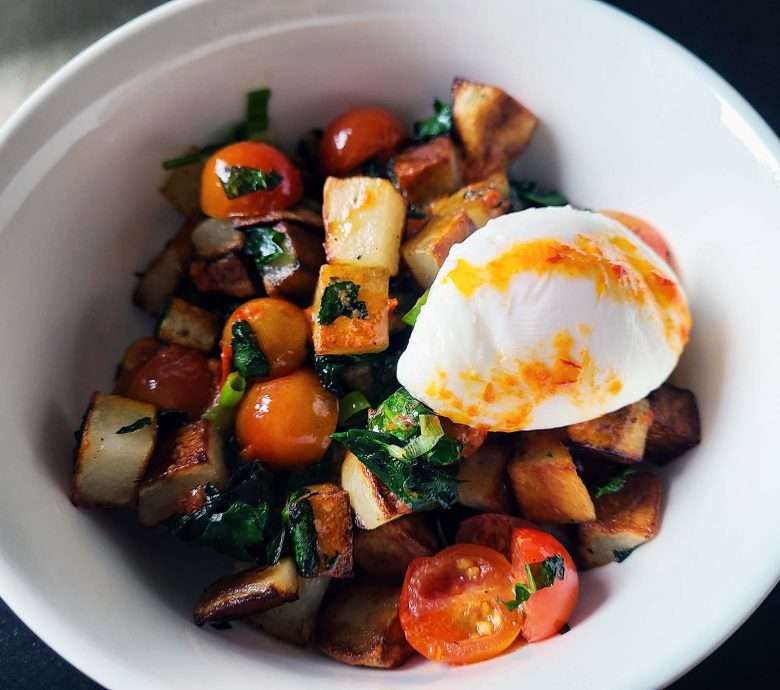 Potato, tomato and spinach breakfast bowls with harissa butter