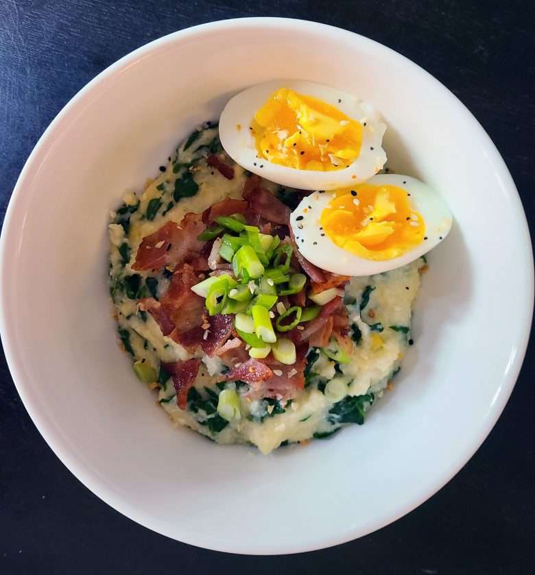 Cheesy spinach grits with bacon and eggs