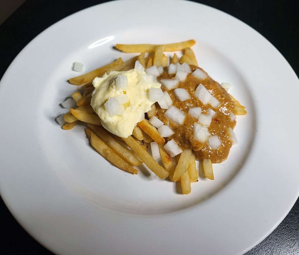 Patatje Oorlog (Fries with Mayonnaise, Satay Sauce, and Onion)